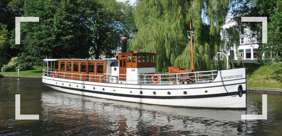Berlin: Historic Boat Sightseeing City Center Tour - Onboard comfort: saloon access, drinks, music, and audio clarity