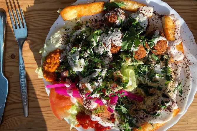 Classic Bites and Culinary Trends Neighborhood Food Tour in Berlin - East Berlin street-snack stop on Schönhauser Allee