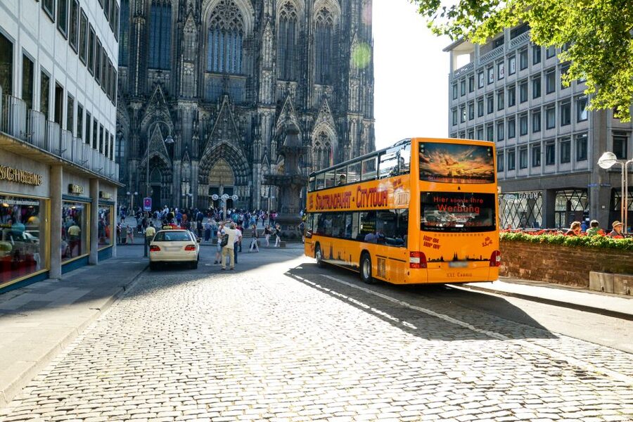 Cologne: 24h Hop-On Hop-Off Sightseeing Bus Ticket - On Board: Double-Decker Views, Headphones, and Seating Reality