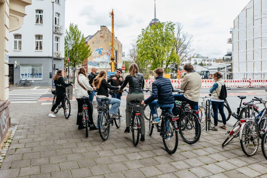 Cologne: Ehrenfeld Street Art Bike Tour - Brüsseler Platz: where the route builds momentum
