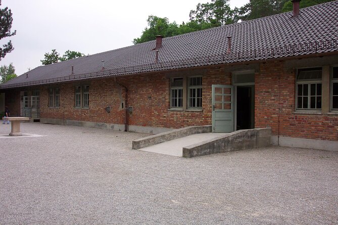 Dachau Concentration Camp Memorial Tour with Train from Munich - Inside the camp: cells, barracks, and the gas chamber