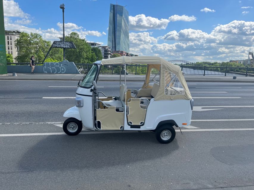 Frankfurt: Private Sightseeing Tour in Retro Ape Calessino - What the guide adds at the Iron Bridge, Old Town, and coronation path