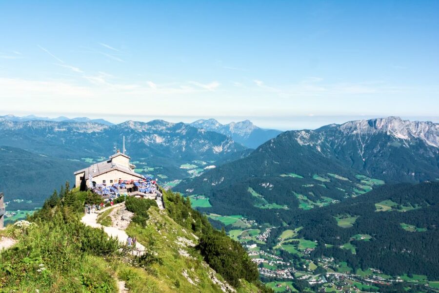 From Munich: Guided Group Tour to Eagle’s Nest - Inside Eagle’s Nest: lower rooms, plate-glass windows, and visible scars