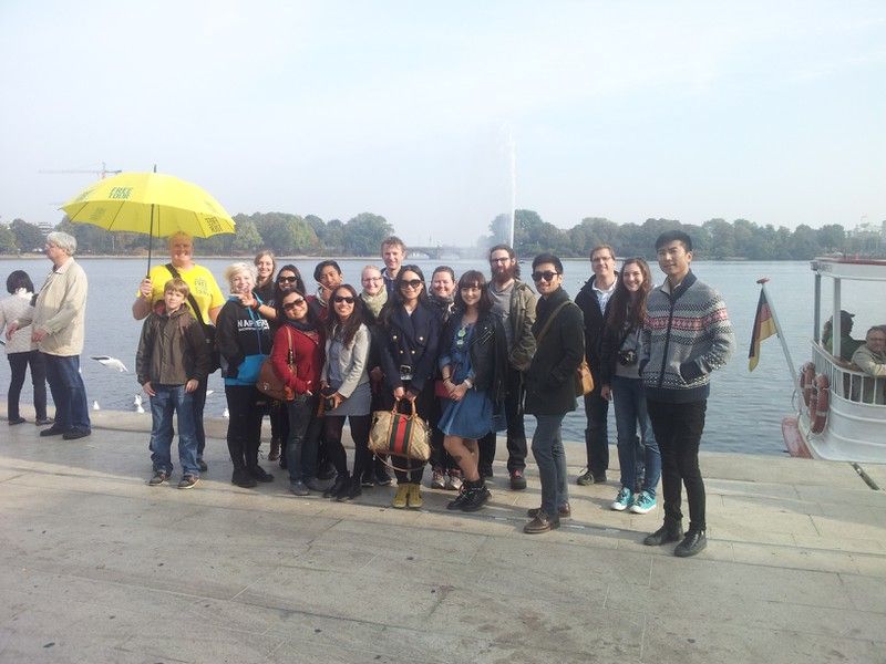 German Hamburg Historic City Center Pay-What-You-Want Tour - Town Hall meetup with bright yellow umbrellas