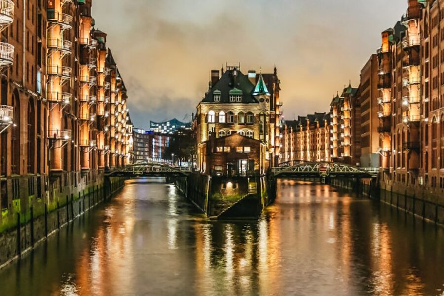 Hamburg: 1.5h Grand Harbor Evening Lights Cruise - Speicherstadt canals in blue light, with one important reality check
